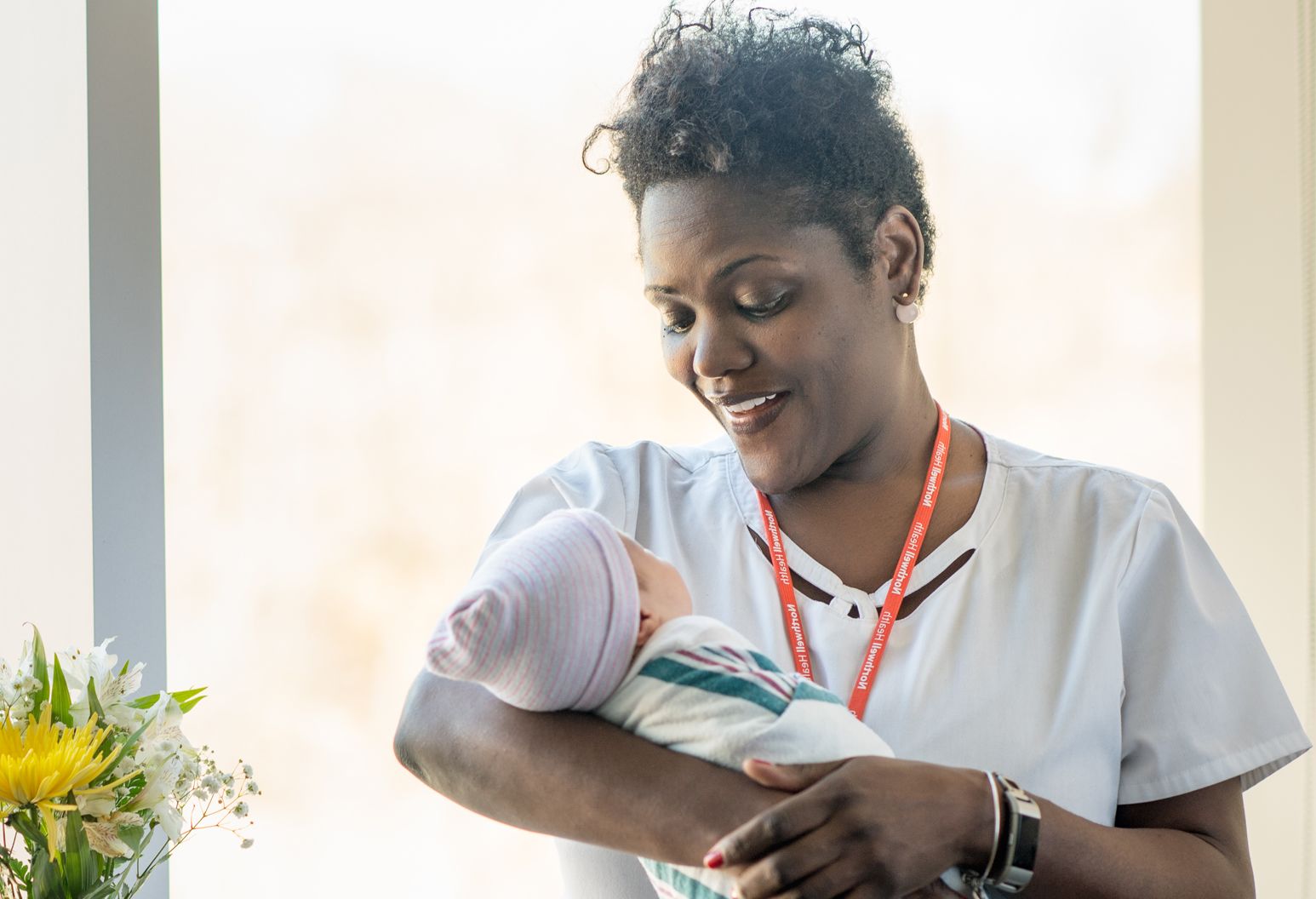 Nurse holding a newborn baby